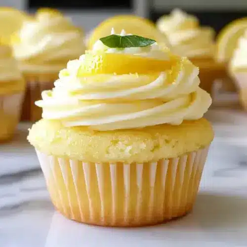 Cheesecake Stuffed Lemon Cupcakes with Lemon Frosting